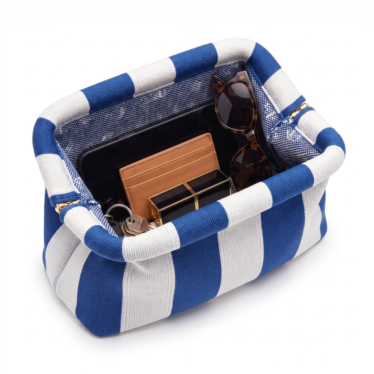 Cobalt & White Stripe Cloud Pouch shown open with everyday items inside