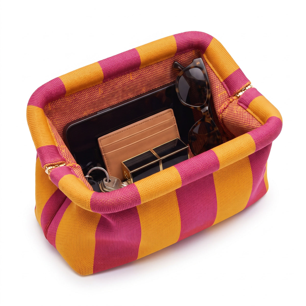 Marigold & Fuchsia Stripe Cloud Pouch shown open with everyday items inside