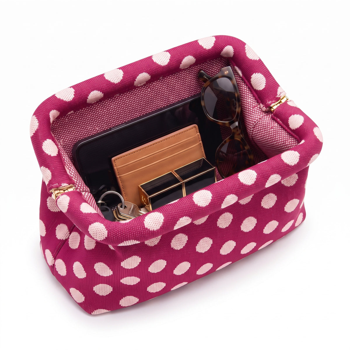 Magenta Polka Dot Cloud Pouch open — flex frame, mesh lining, fits phone, wallet, keys