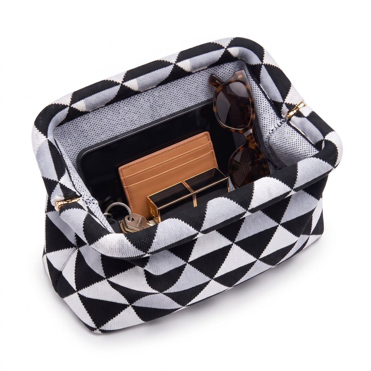 Monochrome Triangle Cloud Pouch open — flex frame, mesh lining, fits phone, wallet, keys