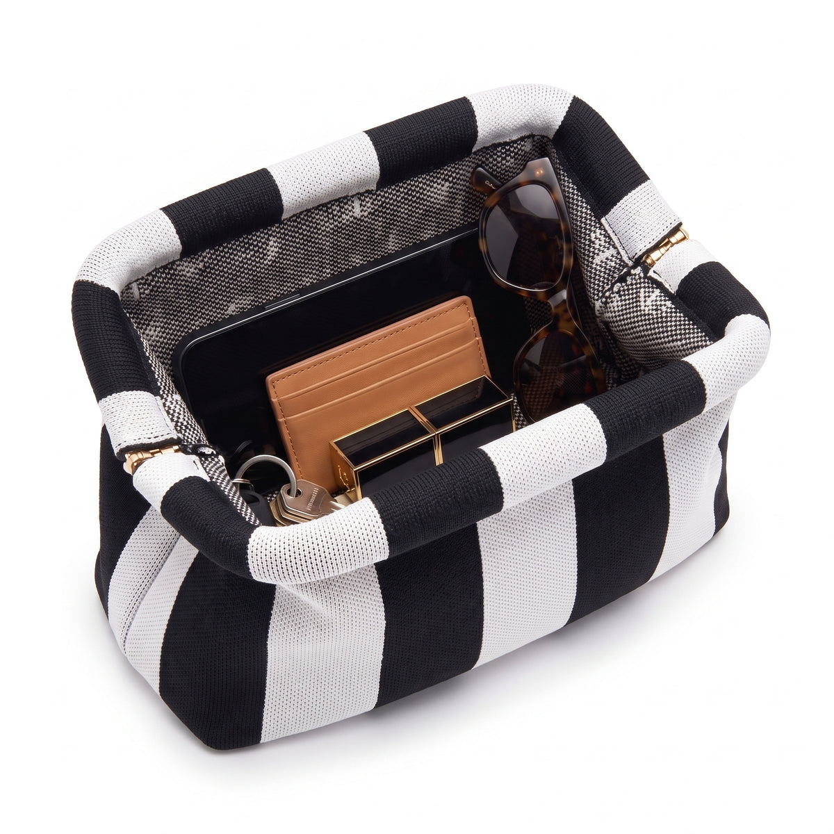 Monochrome Wide Stripe Cloud Pouch shown open with everyday items inside