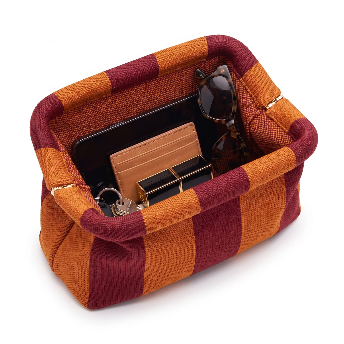 Rust & Orange Stripe Cloud Pouch shown open with everyday items inside