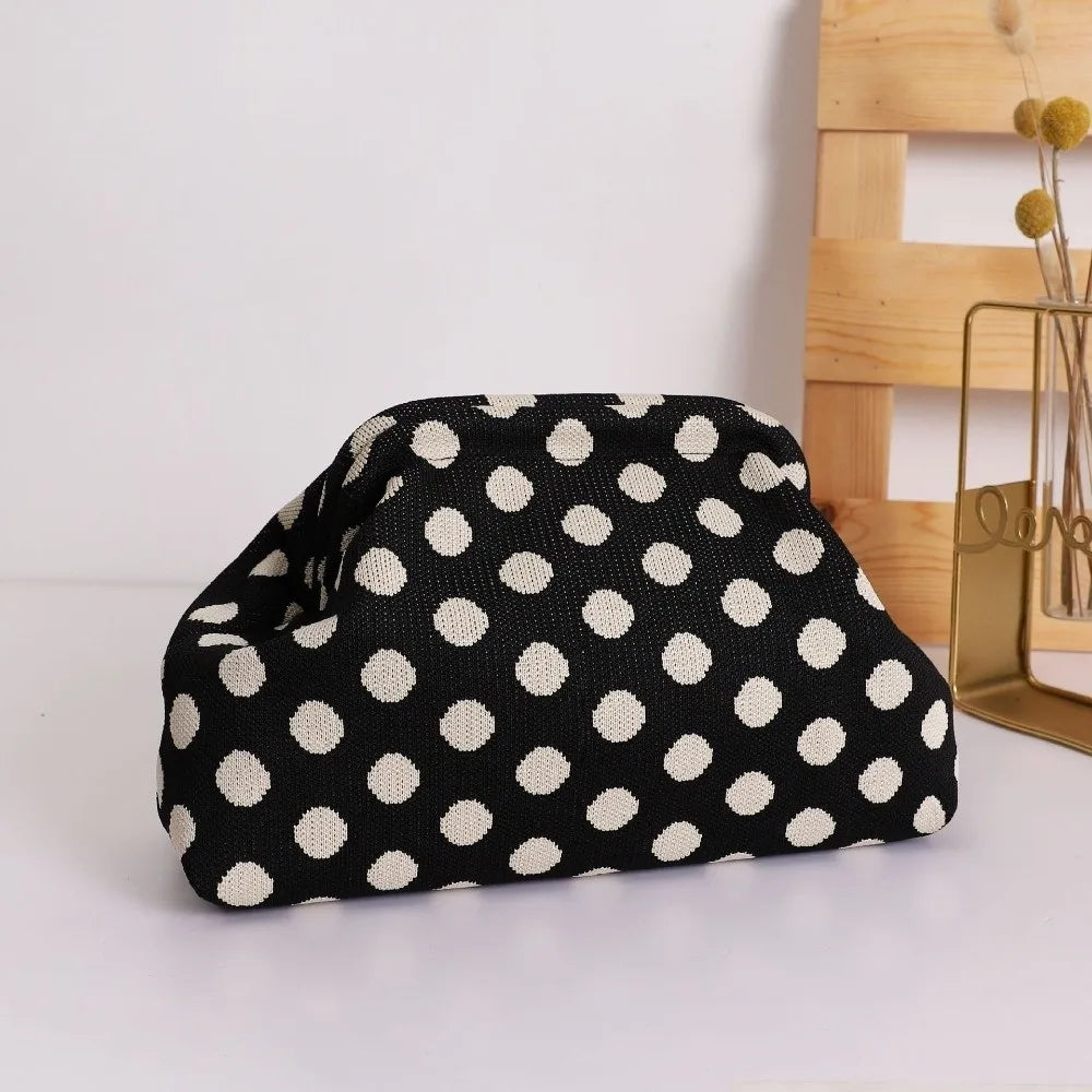 Black Polka Dot Cloud Clutch on a shelf
