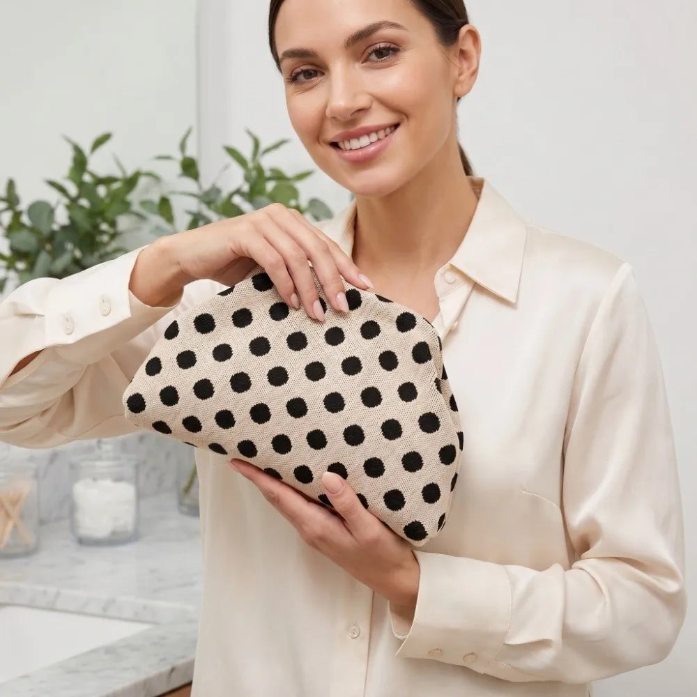 Beige Polka Dot Cloud Clutch held in hand