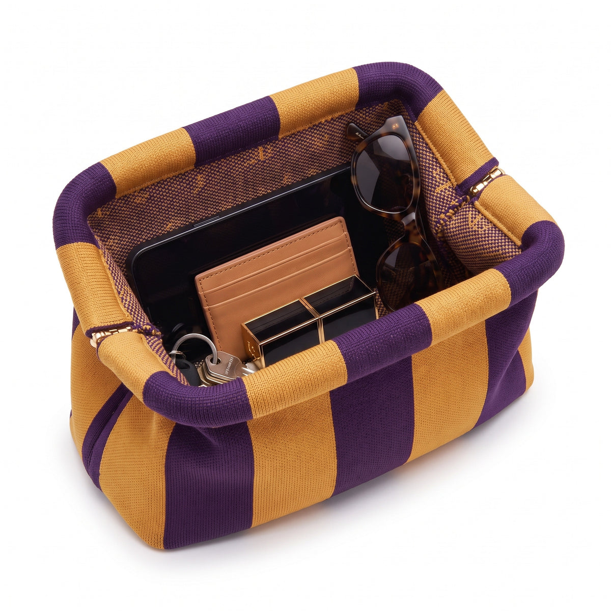 Amber & Plum Stripe Cloud Pouch shown open with everyday items inside