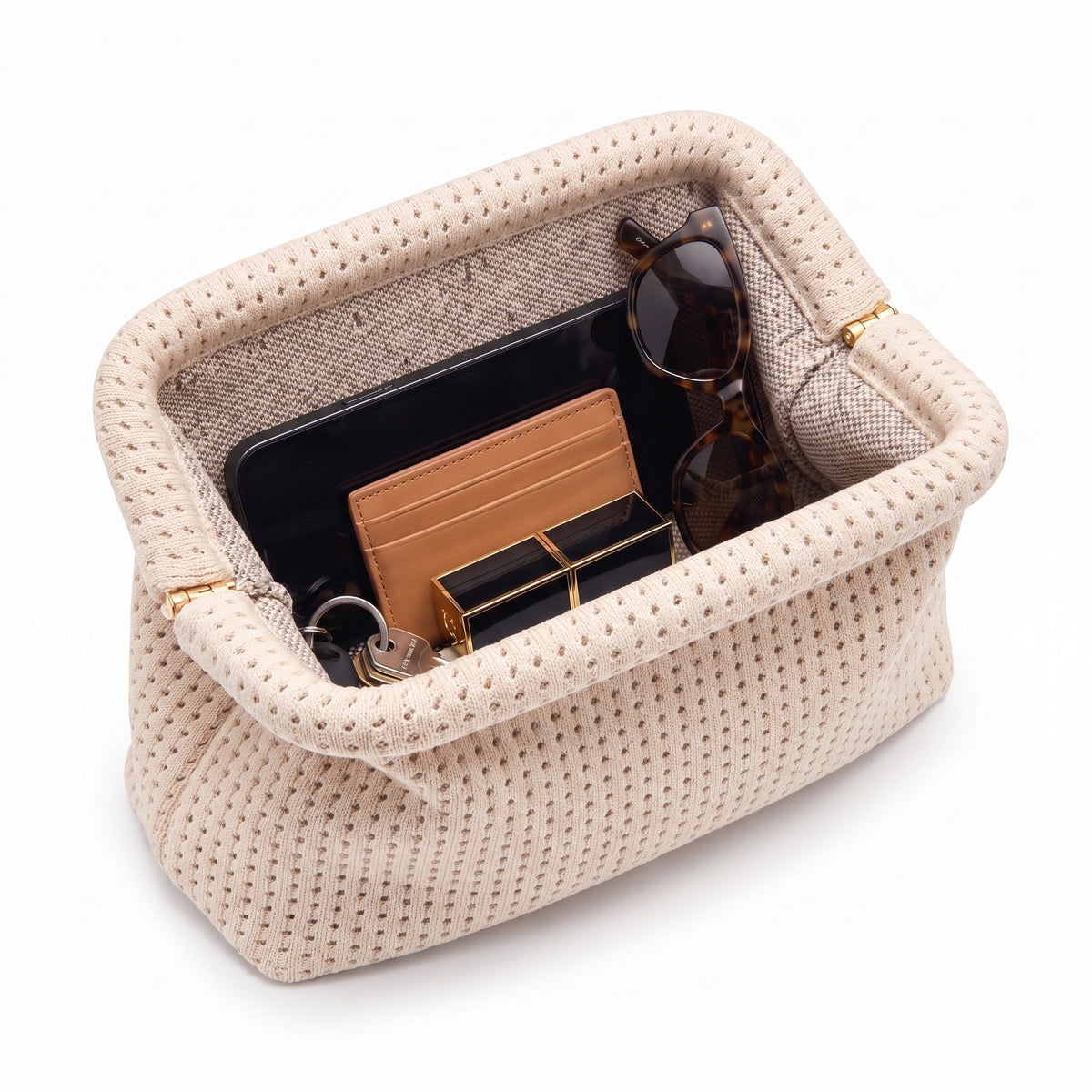 Cream Waffle Cloud Pouch open — flex frame, fits phone, wallet, keys