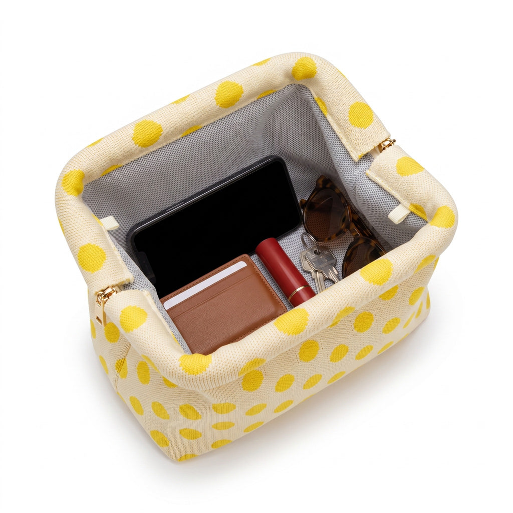 Lemon Polka Dot Cloud Clutch open — flex frame, mesh lining, fits phone, wallet, keys