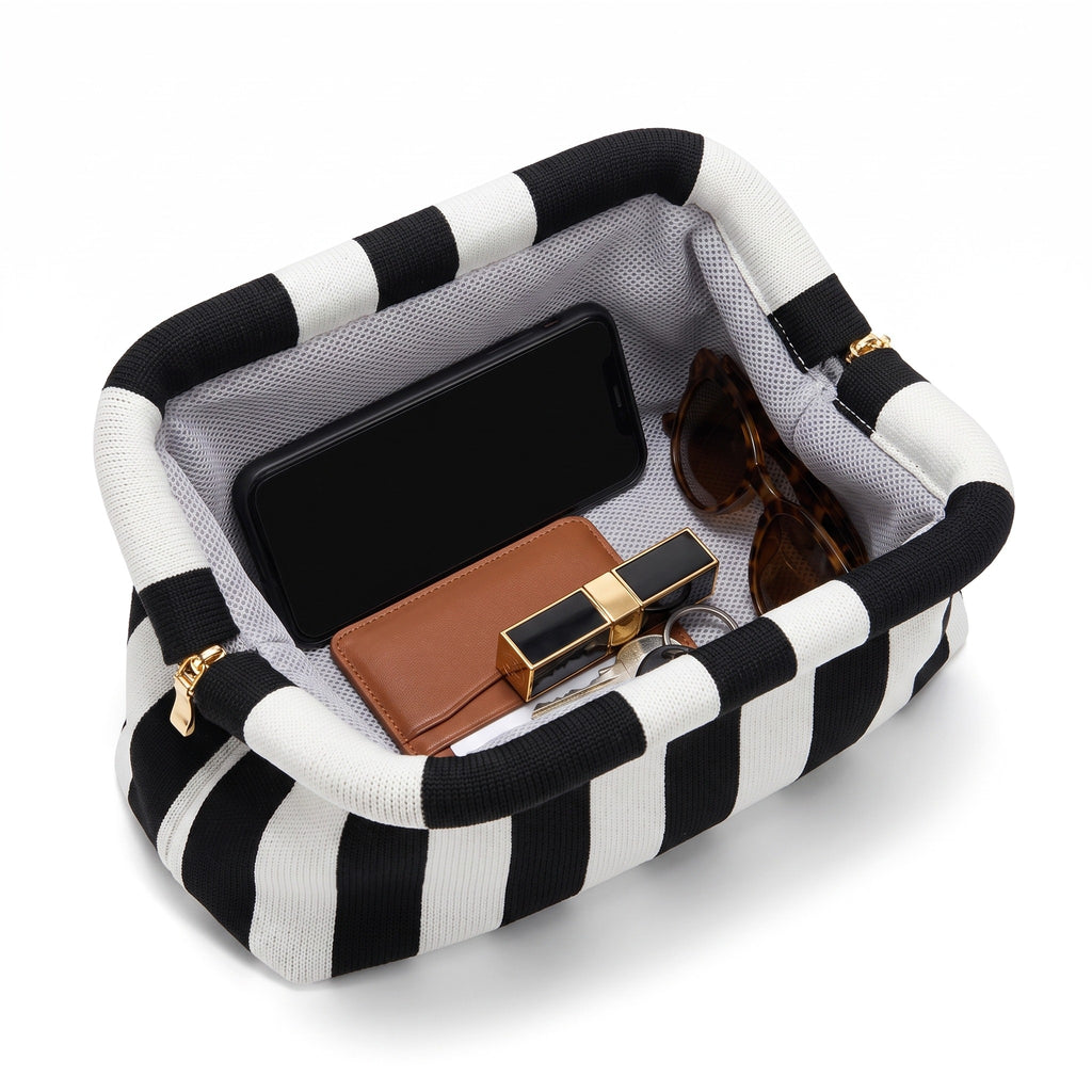 Monochrome Stripe Cloud Clutch open — flex frame, mesh lining, fits phone, wallet, keys