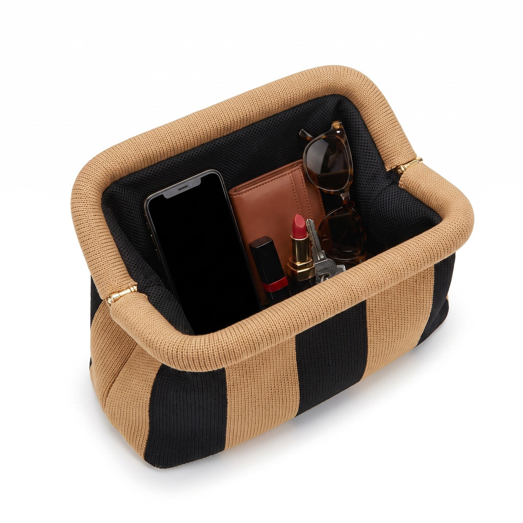 Sand & Black Stripe Cloud Clutch open — flex frame, mesh lining, fits phone, wallet, keys