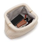 Cream Waffle Cloud Pouch open — flex frame, fits phone, wallet, keys