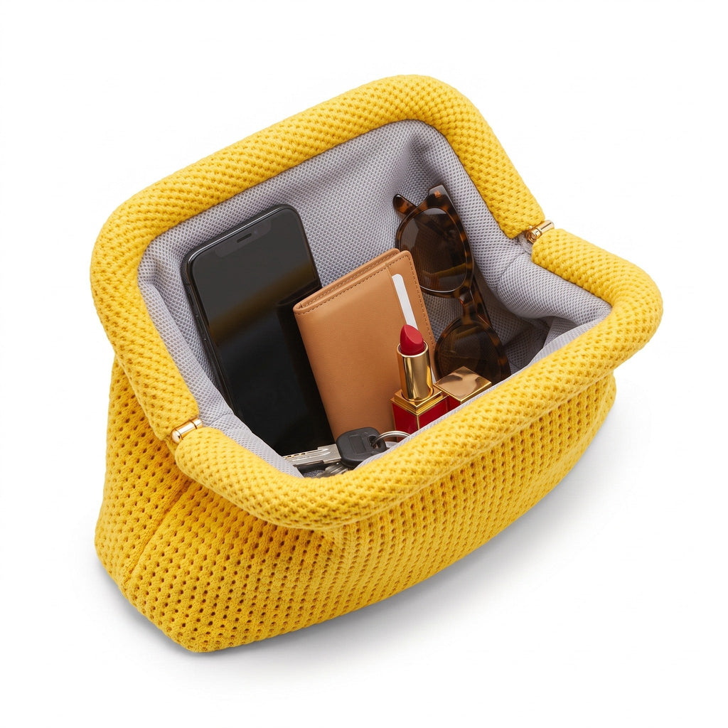 Butter Yellow Waffle Cloud Pouch open — flex frame, fits phone, wallet, keys
